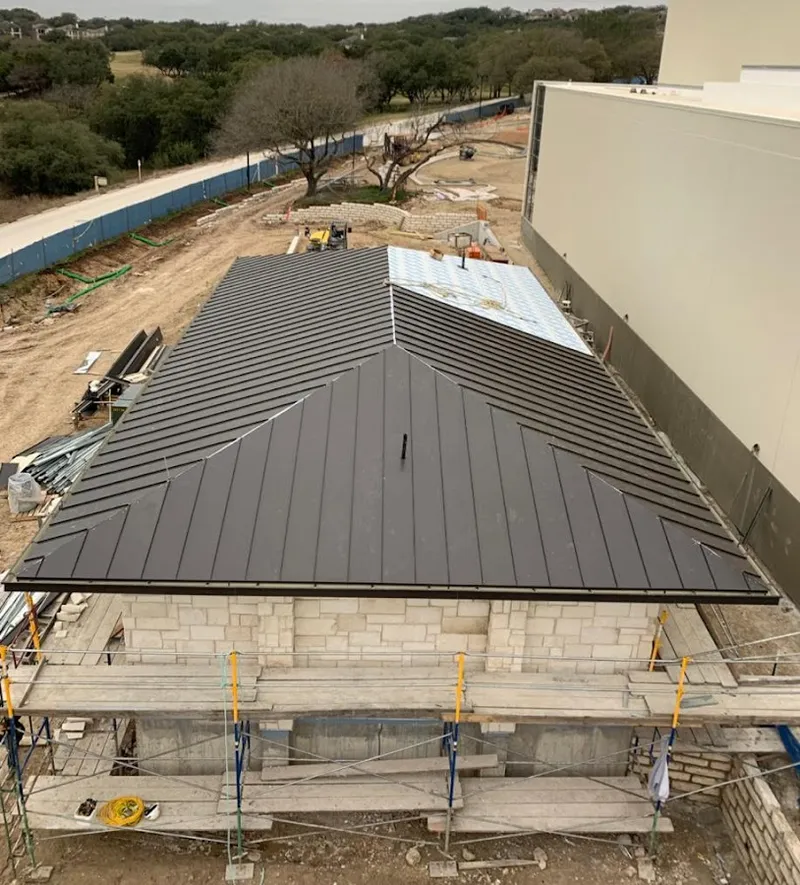 Metal roof new construction with scaffolding in Flower Mound